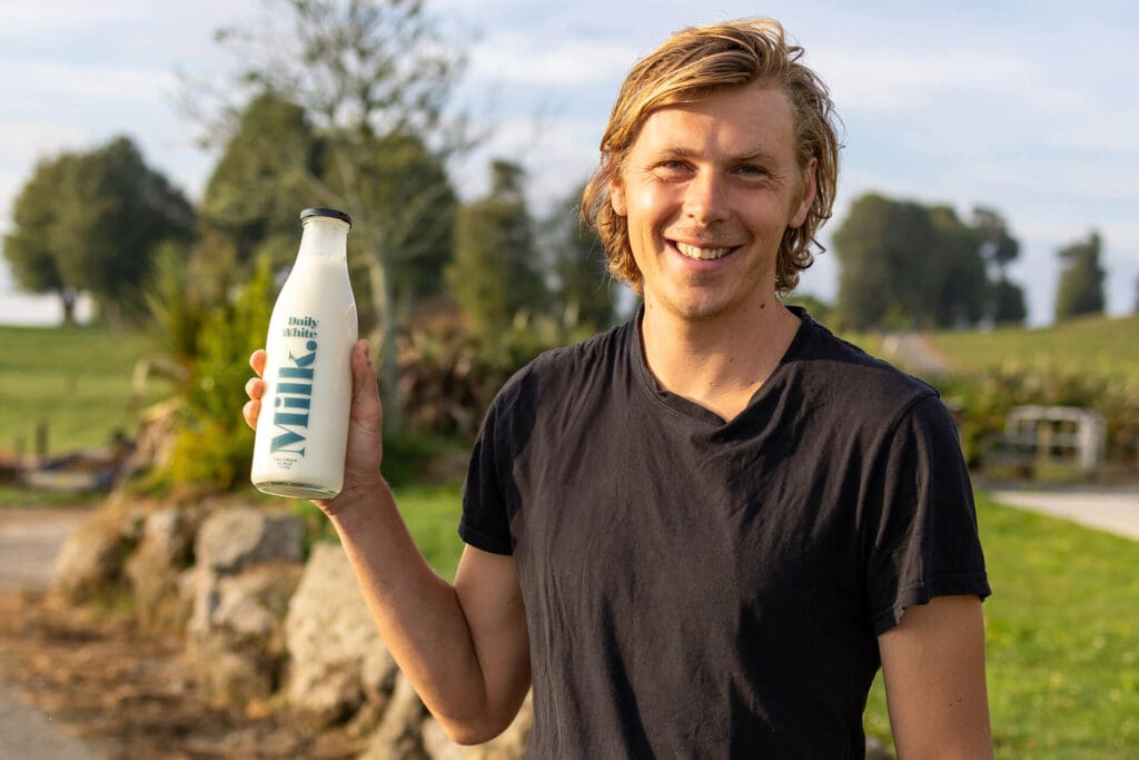 Hamish Hodgson pportrait with his Milk from Volcanic Creamery in NZ